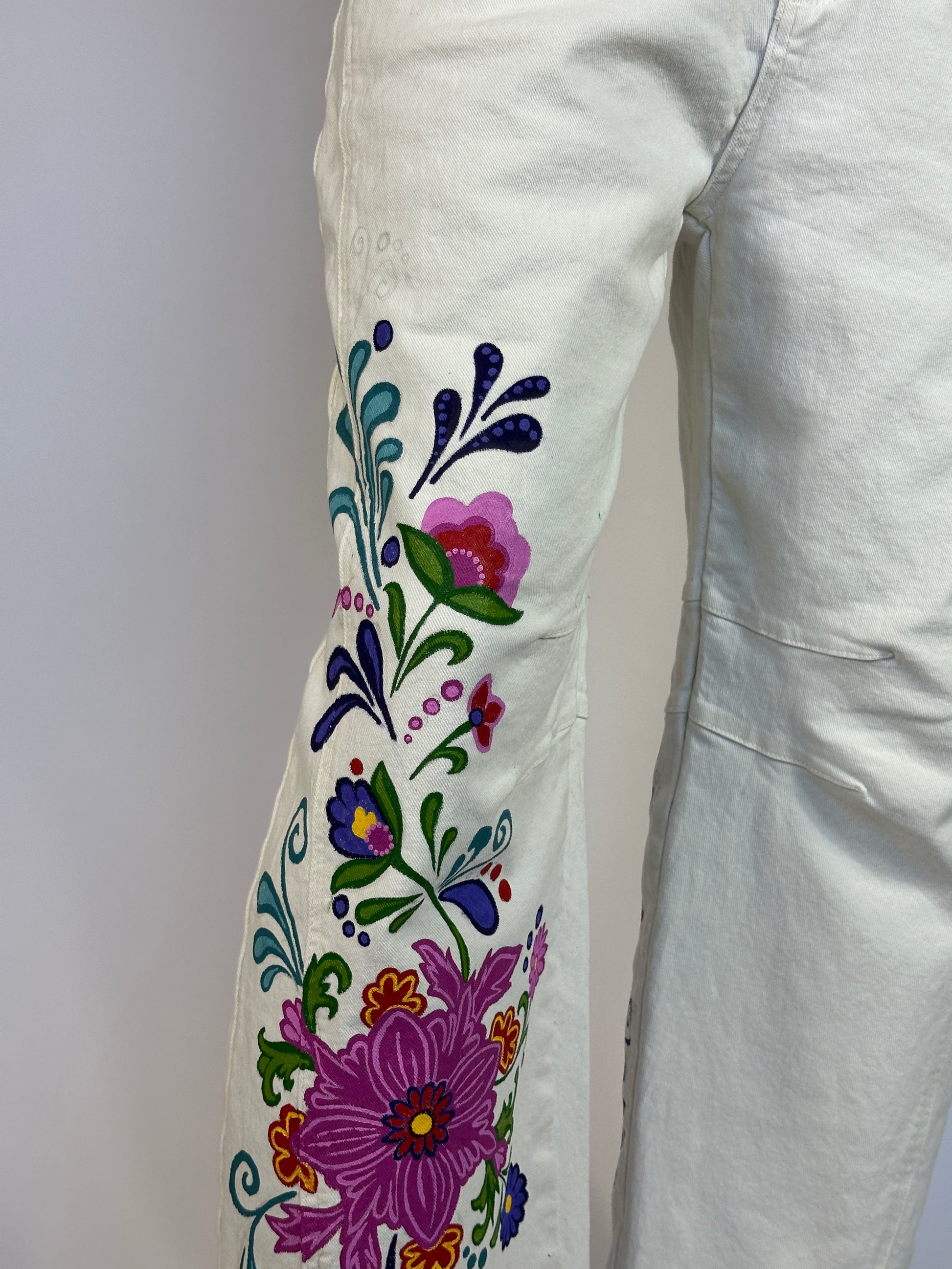 Embroidered floral design on a white fabric background