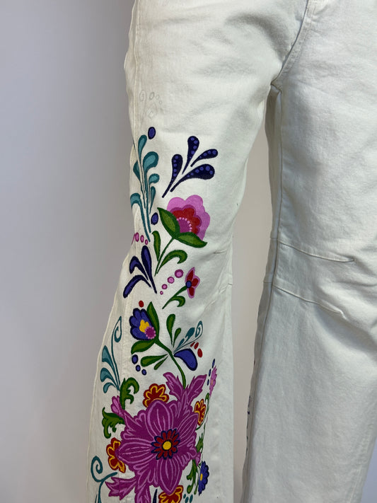 Embroidered floral design on a white fabric background